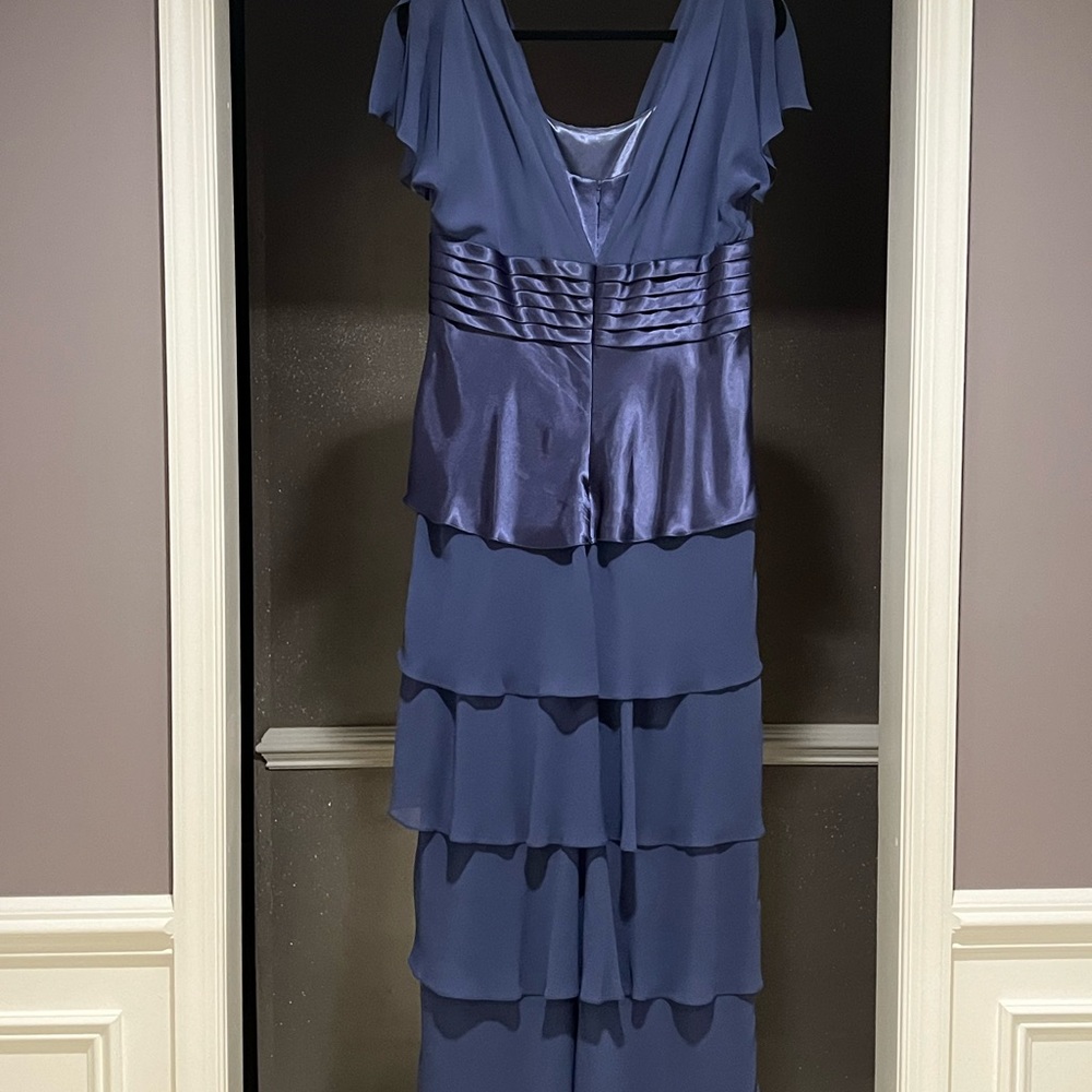Beautiful fluttery blue Petra Fashion dress is size 12 and worn once.